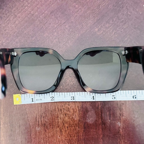 Gucci GG1300S tortoiseshell square-frame sunglasses.